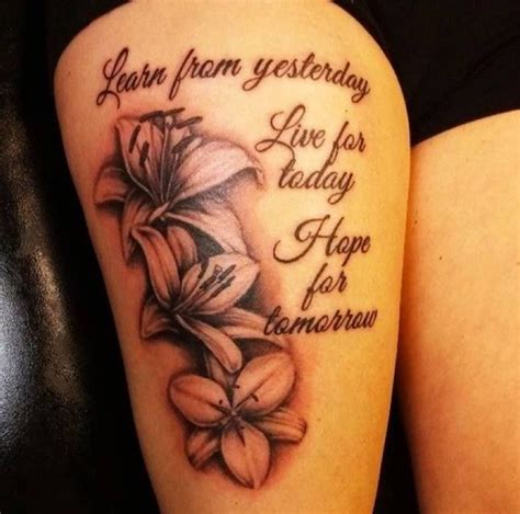 flower thigh tattoos for women|thigh quote tattoos for females.